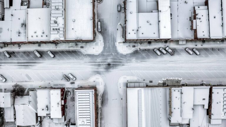 Aerial of snow-covered urban businesses