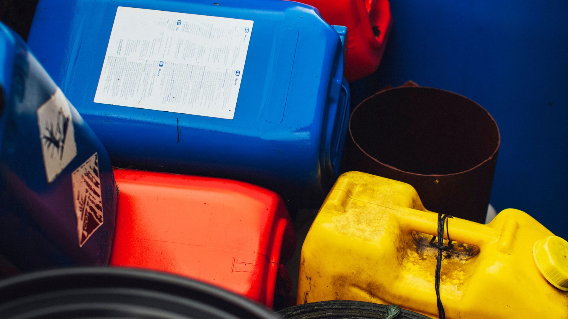 Plastic containers of automotive fluids